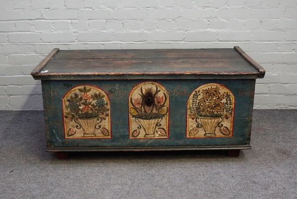 A 19th century North European polychrome painted pine rectangular lift top trunk, on block feet, 119cm wide x 53cm high