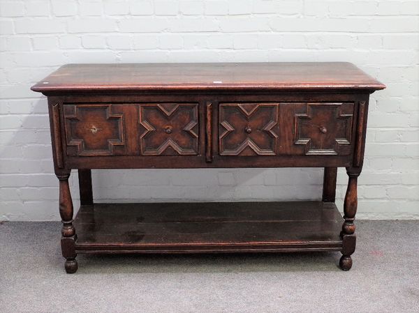 A 17th century and later oak dresser base, the pair of geometric moulded drawers on baluster turned supports, united by pot board undertier, 138cm wid