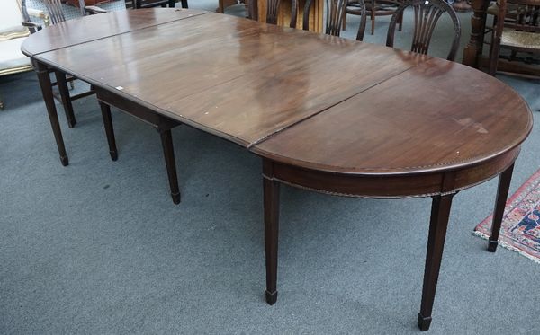 An 18th century mahogany extending dining table with central drop flap section, 132cm wide x 302cm long extended.