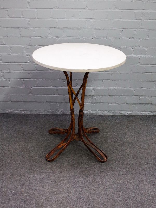 An early 20th century occasional table, the circular limestone top on a yellow painted wrought iron base, 64cm diameter x 74cm high.