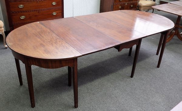 A mid-18th century inlaid mahogany extending dining table with a pair of 'D' end sections and three extra leaves on tapering square supports, 114cm wi