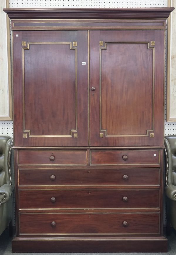 A Victorian brass mounted linen press with pair of panelled doors enclosing four trays over two short and three long graduated drawers, 144cm wide x 2