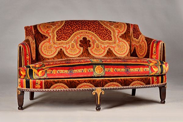 An early 19th century Continental style salon suite with Versace upholstery to comprise sofa, 160cm wide x 85cm high, pair of armchairs, 85cm wide x 8