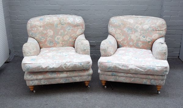 A pair of Howard style easy armchairs on turned beech supports, 80cm wide x 80cm high.