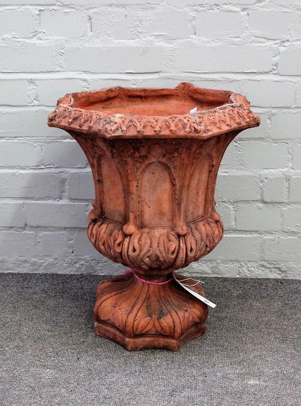 A Gothic style terracotta hexagonal garden urn, with moulded decoration, 43cm wide x 50cm high.