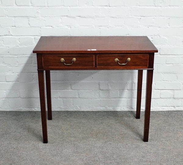 A 19th century inlaid mahogany two drawer writing table on block supports, 80cm wide x 70cm high.