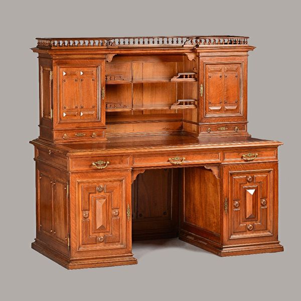 Meubles Hebtensten Paris; a late 19th century walnut writing desk, with fitted superstructure over nine drawers (behind cupboards) about the knee, 148