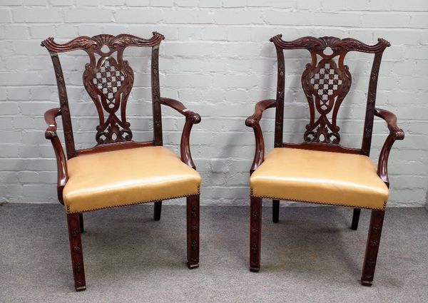 A pair of 18th century mahogany carver chairs with pierced latticed splat and blind floral fret carved decoration, 66cm wide x 97cm high.