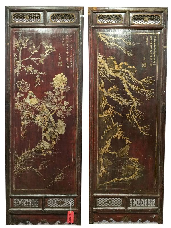 A pair of Chinese framed rectangular panels, gilt decorated with birds and hares amongst foliage, each 75cm wide x 213cm high.