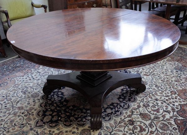 A George IV mahogany centre table, the circular snap top on quatrefoil platform and scroll feet, 139cm diameter x 73cm high.