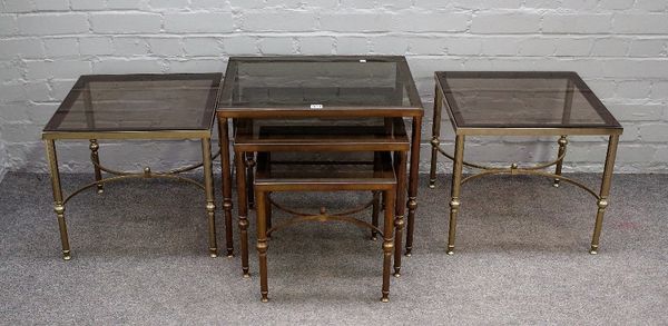 A pair of mid-20th century lacquered brass and smoked glass square occasional tables on fluted supports and 'X' frame stretchers, 46cm wide x 41cm hig