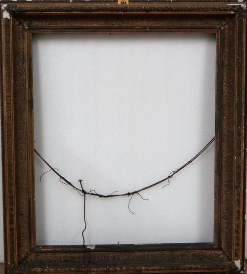 A group of four 19th and early 20th century gilt plaster frames, the largest aperture 67.5cm x 56.5cm.