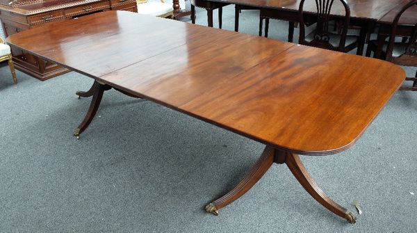 A George III style mahogany D-end extending dining table on six downswept supports, with two extra leaves, 117cm wide x 148cm long x 268cm long extend