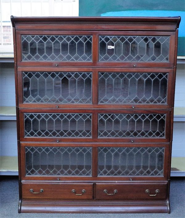 A Globe Wernicke style mahogany double bookcase with four up and over doors over a pair of drawers 129cm wide x 163cm high.