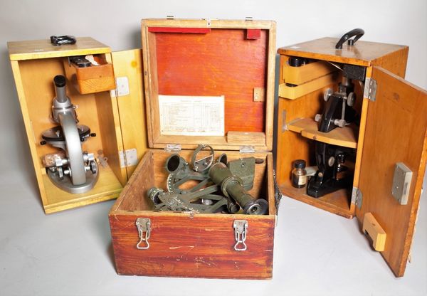 'MCN', a 20th century cased Sexton, 29cm wide x 20cm high and two cased 20th century microscopes, 20cm wide x 38cm high, (3). S2B