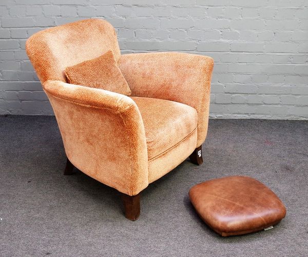 John Sankey; a modern easy armchair on tapering splayed block supports, 85cm wide x 80cm high and a John Sankey low leather upholstered footstool, 45c