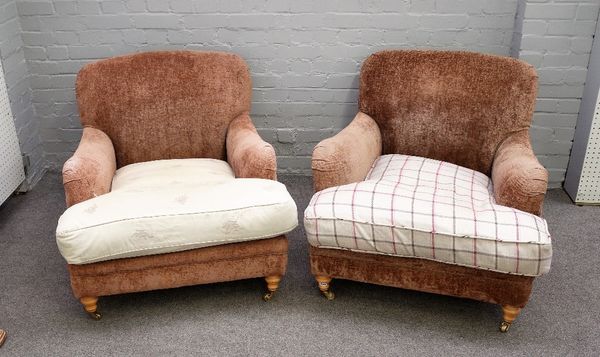 A pair of Howard style easy armchairs, on turned beech supports, 85cm wide x 75cm high, (2)