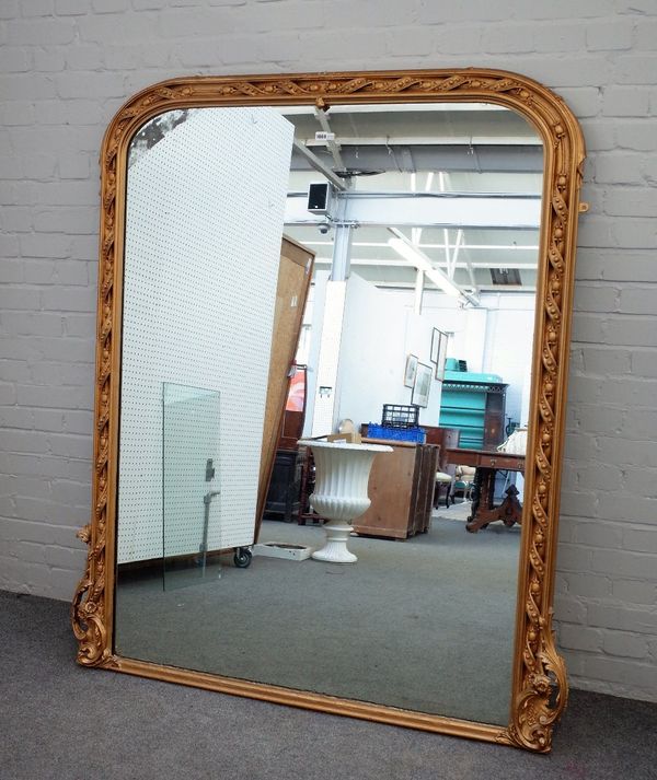 A Victorian gilt framed arch top overmantel mirror, with ribbon tied egg and dart moulding, 145cm wide x 168cm high.