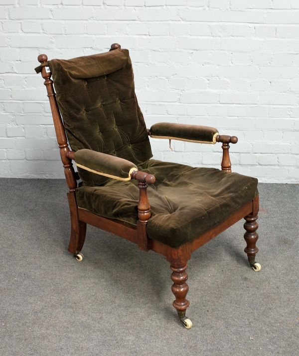 An early 19th century beech and mahogany open armchair with extensive turned decoration, 61cm wide x 94cm high.