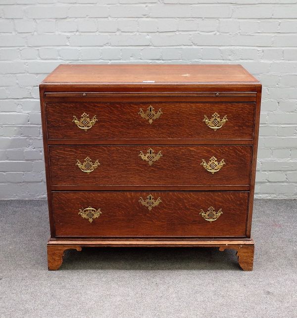 An 18th century oak chest, the brushing slide over three long graduated drawers, on bracket feet, 97cm wide x 93cm high.