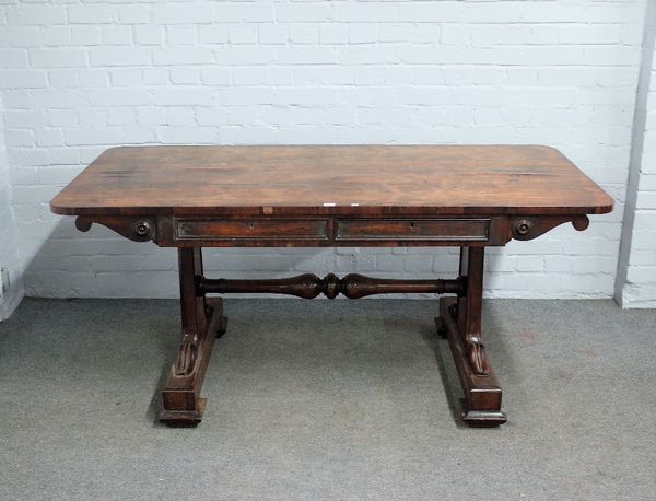 A William IV rosewood centre table, the rounded rectangular top over pair of frieze drawers on slab trestle supports, 163cm wide x 73cm high.