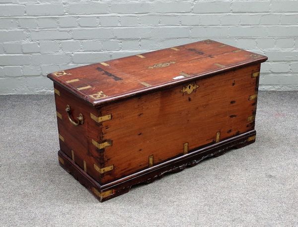 A 19th century Anglo Indian brass bound rectangular trunk, on shaped plinth, 96cm wide x 47cm high.