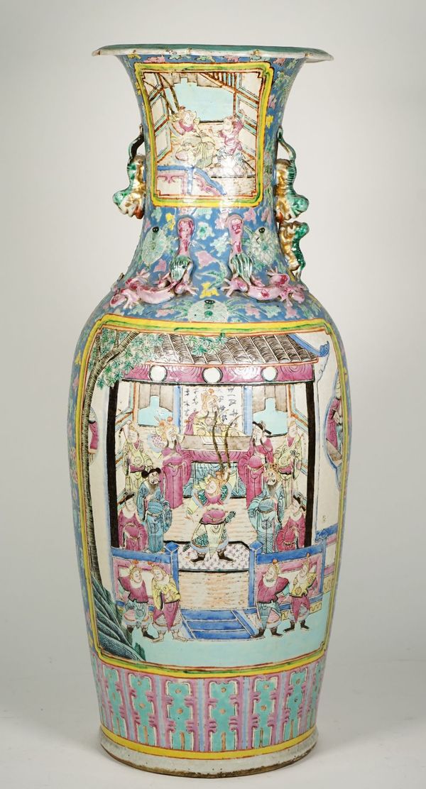 A Chinese famille-rose baluster vase, late 19th century, painted on one side with an official and attendants, the reverse with a battle scene against