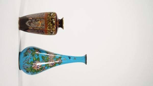 A Japanese cloisonné small vase, Meiji period, of tapered hexagonal form, each side worked with a lappet panel enclosing a ho-o bird alternating with