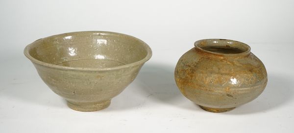 A Korean celadon glazed pottery bowl, Goryeo dynasty, 13th century, steeply raised sides with everted rim, covered in an olive green glaze, 16.5cm. di