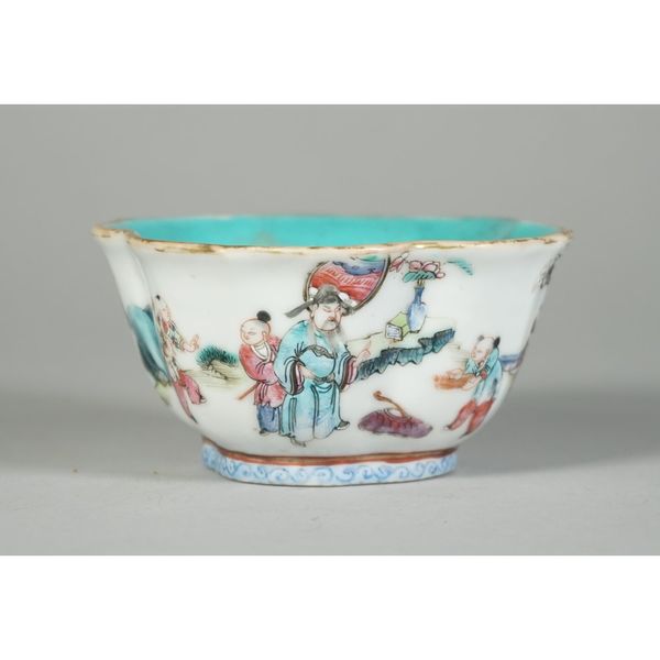 A small Chinese famille rose bowl, iron-red Tongzhi seal mark and probably of the period, enamelled with adults and boys in a landscape beneath a gilt