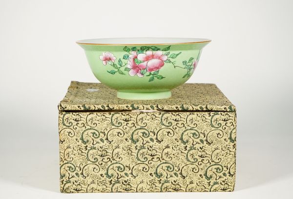 A Chinese sgraffito green-ground famille-rose bowl, blue Qianlong seal mark but later. enamelled on the exterior with flower sprays, 18.25cm. diameter