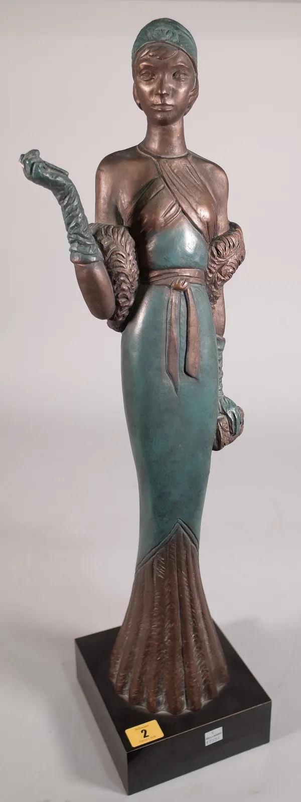 A faux bronze Art Deco type figure on plinth base, 67cm high.  C5