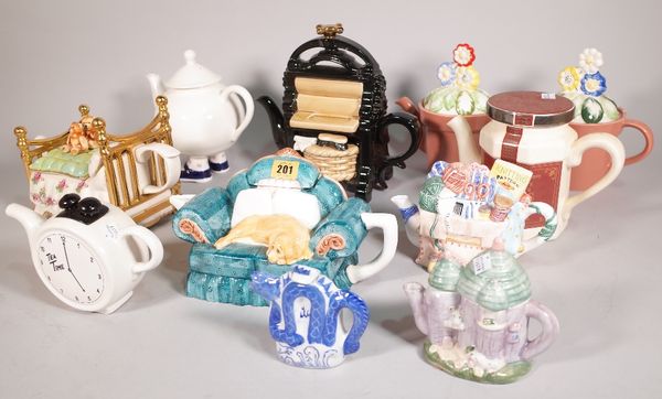 A quantity of 20th century novelty teapots, mostly formed as furniture, plant pots and sundry, the largest 25cm high, (qty). S5M