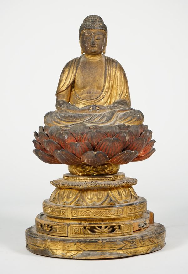 A Japanese giltwood figure of Amida Buddha, probably 19th century, seated in vajrasana on a red painted lotus pedestal on a circular carved stepped ba