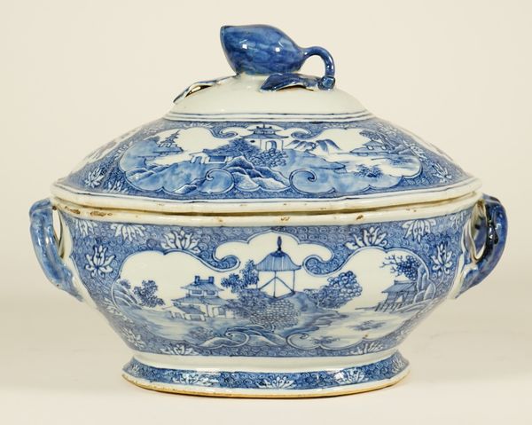 A Chinese export blue and white shaped oval tureen and cover, Qianlong, painted with panels of pavilions in river landscapes alternating with panels o