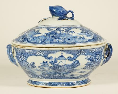 A Chinese export blue and white shaped oval tureen and cover, Qianlong, painted with panels of pavilions in river landscapes alternating with panels o