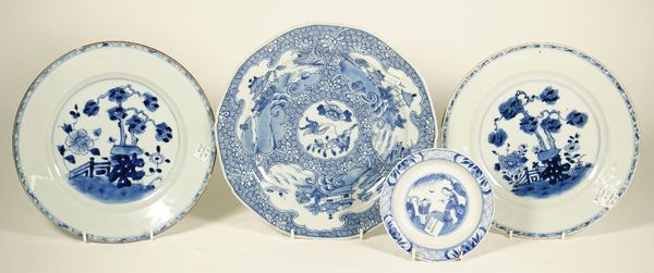 A Chinese blue and white plate, Qianlong, painted with a central panel of flowers and insects against a whorl pattern ground reserved with three ruyi-