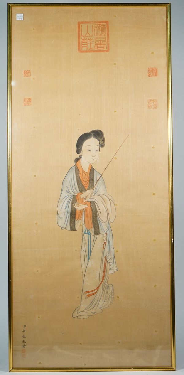 Chinese school,. 20th , a painting on silk of a young woman standing holding a stick, signed, 96cm. by 42 cm., framed and glazed.