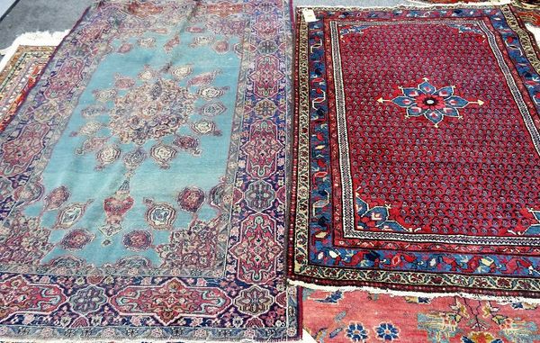 A Saraband rug, Persian, the madder field with rows of boteh, an indigo border and a very worn Kerman rug, (2).   C4