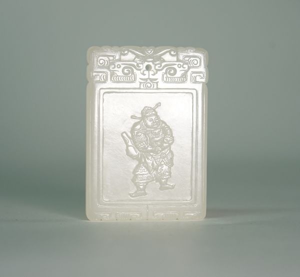 A Chinese white jade rectangular pendant, carved on one side with a warrior, the reverse with rows of calligraphy, 5.75cm. high.