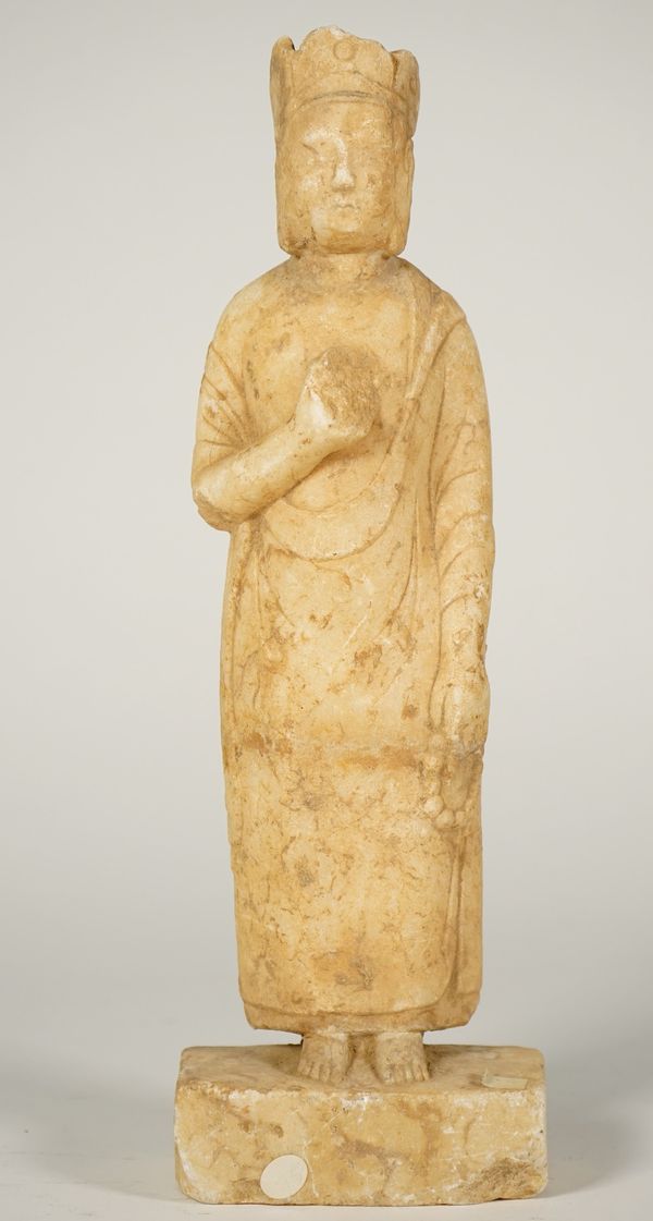 A Chinese Tang-style marble figure of an attendant, standing in long robes with right hand raised to his chest, (a.f), 29cm. high.