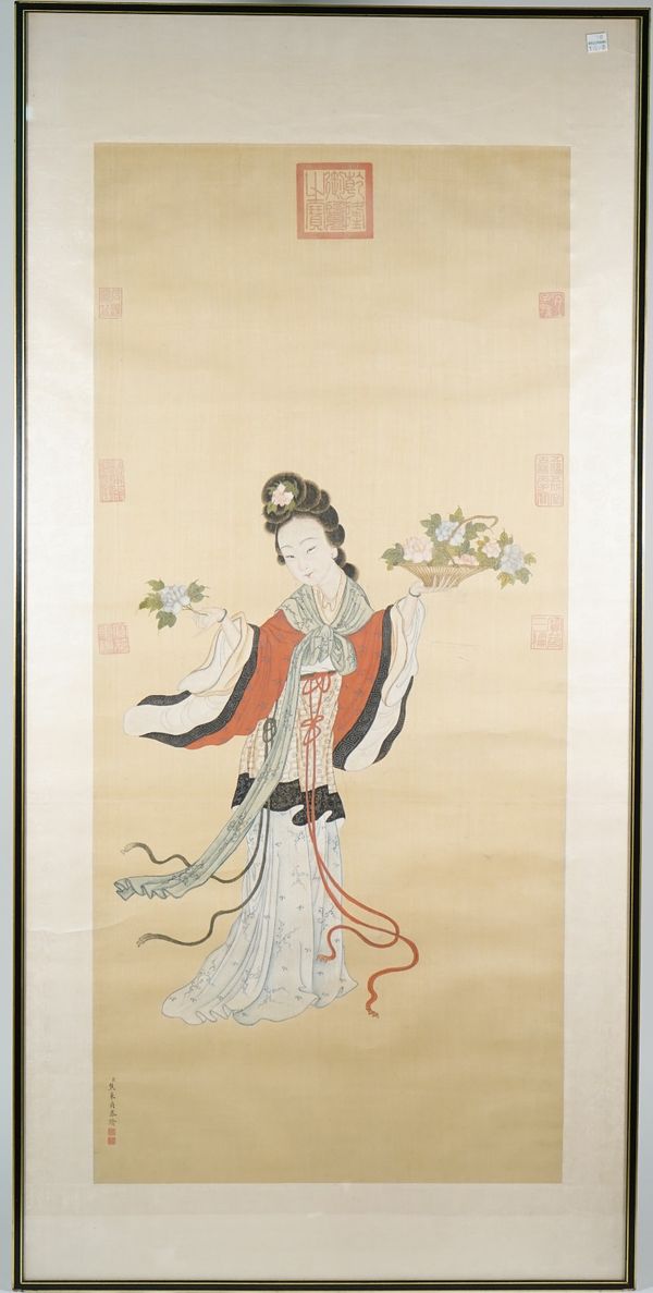 Chinese school, 20th century, a painting on silk of a young woman holding flowers, signed, image 95cm. by 43cm., framed and glazed.