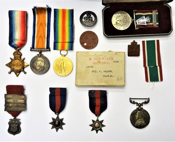 A 1914-15 Star to 19559 PTE.C.PALMER. NORF. R., a 1914-18 British War Medal and a 1914-19 Victory medal to 19559 PTE.C.PALMER. NORF.R, a cardboard box