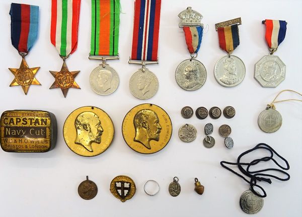 Four Second World War medals, comprising; The 1939-45 Star, The Italy Star, The Defence Medal and The War Medal, with a named box of postage and Admir