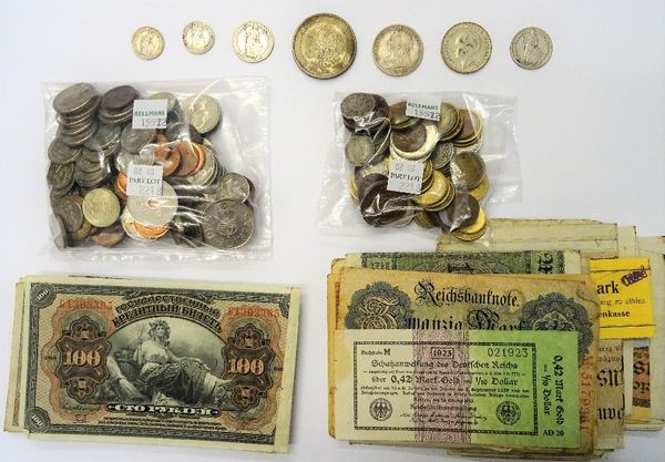 A group of mostly foreign coins, including a German five marks 1932, a Netherlands one guilder 1930, two Swiss francs 1906 and 1912, two Swiss half fr