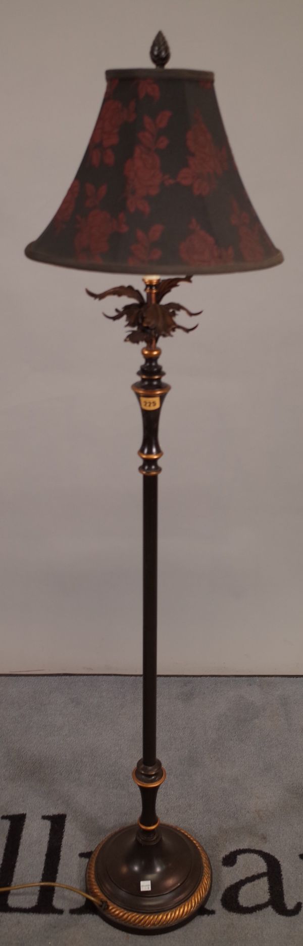 A 20th century black and gold painted floorstanding lamp on circular plinth base, 152cm high.  D3