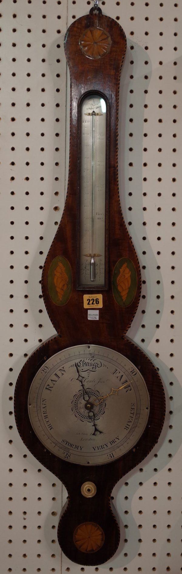 An Edwardian mahogany and shell inlaid wheel barometer, by C.A. Canti Junior, 59, Shoe Lane, London, with thermometer and eight inch silvered dial, 93