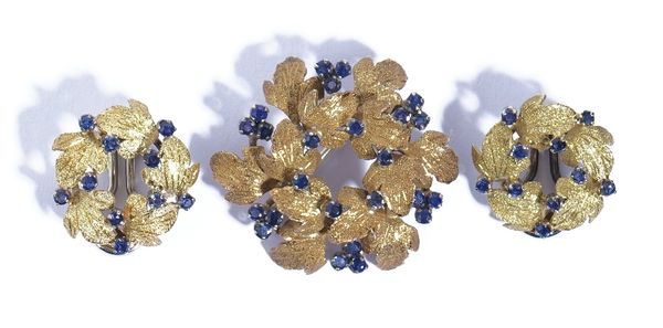 An 18ct gold and sapphire brooch, designed as a hexagonal wreath, having a textured finish, claw set with circular cut sapphires, import mark Birmingh