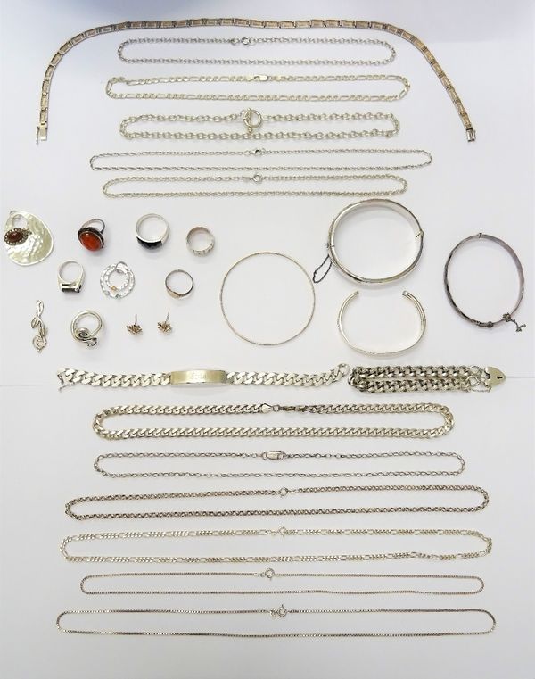 Silver jewellery, comprising; twelve necklaces and neckchains, two bracelets, four bangles, a pair of earstuds, four pendants and six rings, combined