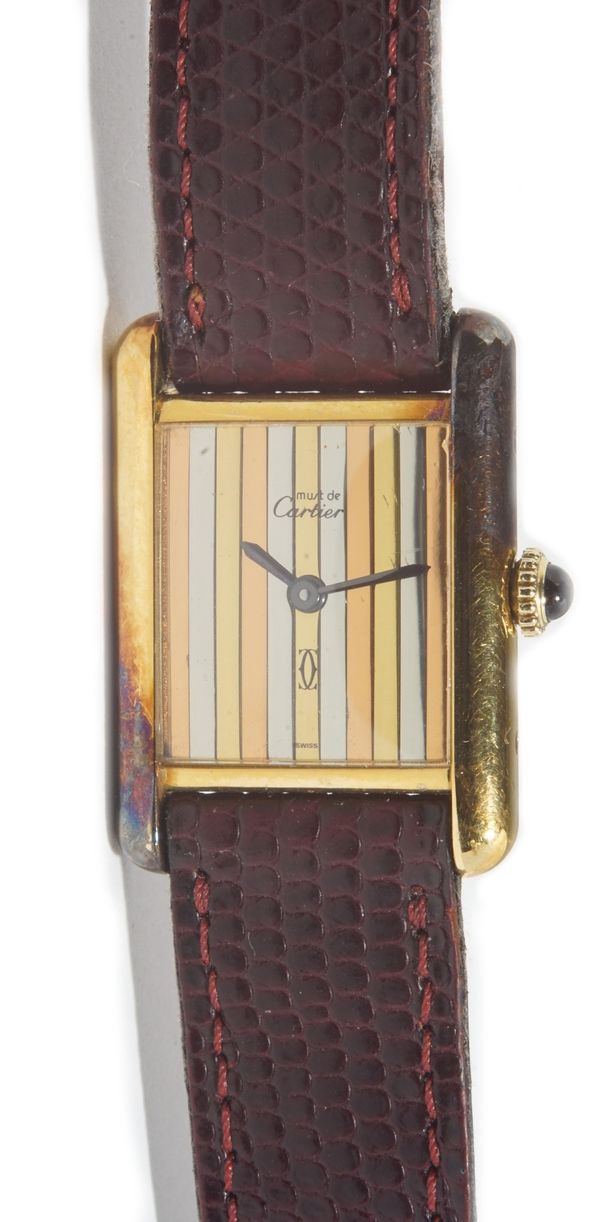 A Must De Cartier silver gilt rectangular cased lady's wristwatch, the signed three colour dial with banded decoration and with black hands, detailed